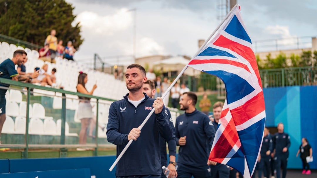 Christian Medina Murphy carrying the GB flag at the 2024 European Padel Championships