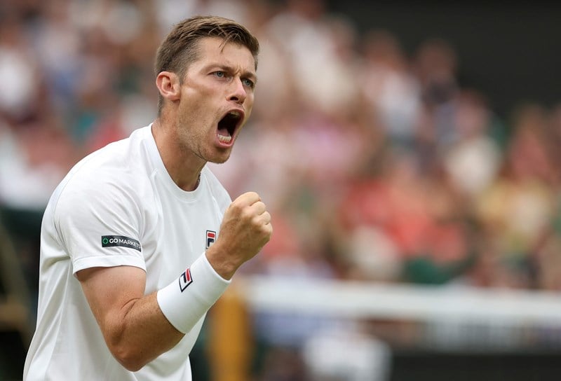 Neal Skupski clenching his fist on court at the Wimbledon final