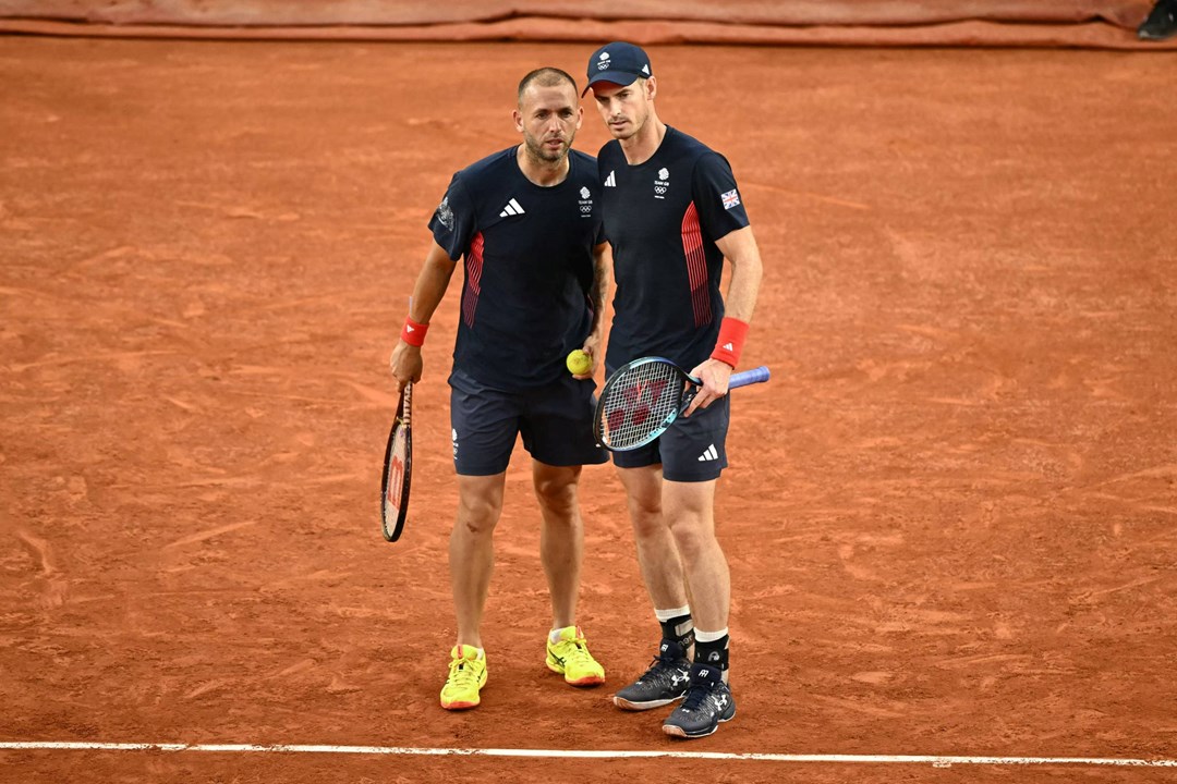 Dan Evans and Andy Murray chatting on court during the Olympics doubles quarter-final