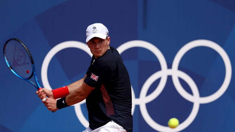 Jack Draper lines up a backhand in the opening round of the Olympics