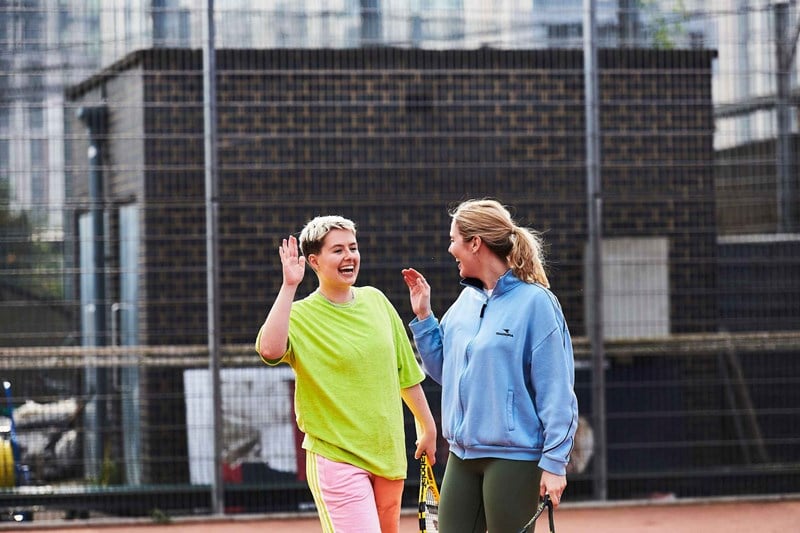 Two women about to high five