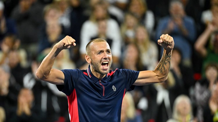 Dan Evans celebrates a win on court