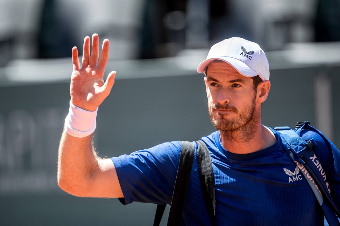 Andy Murray waves to the fans as he walks off court