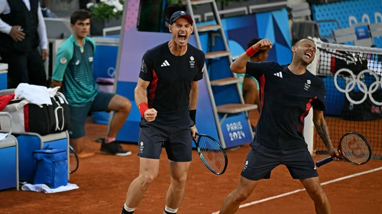 Andy Murray and Dan Evans celebrate their opening round win at the Olympics