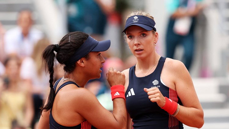 Heather Watson and Katie Boulter interacting on courtt during the women's doubles at the Olympics