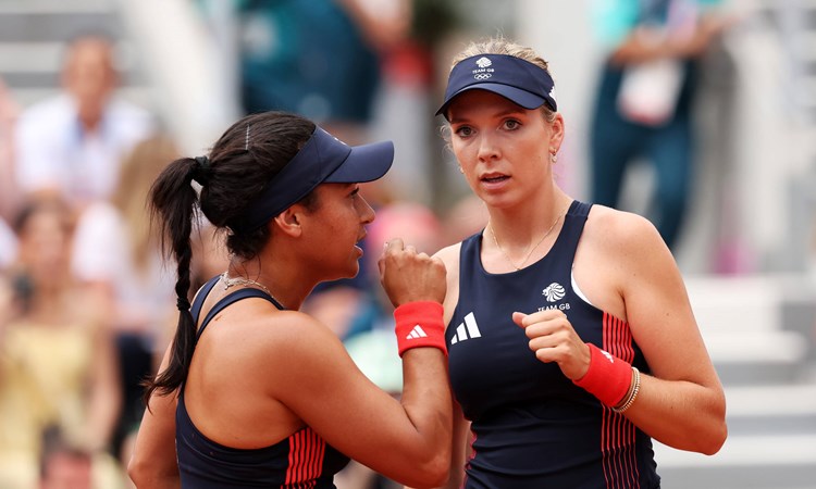 Heather Watson and Katie Boulter interacting on courtt during the women's doubles at the Olympics