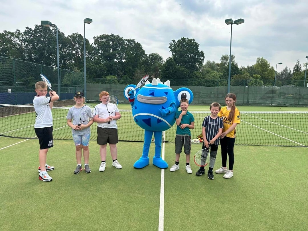 The Achieving Goalz and Dreams tennis group pictured with one of the six Tennisables on the Edgbaston Priory Club practice courts at the Rothesay Classic Birmingham 2023