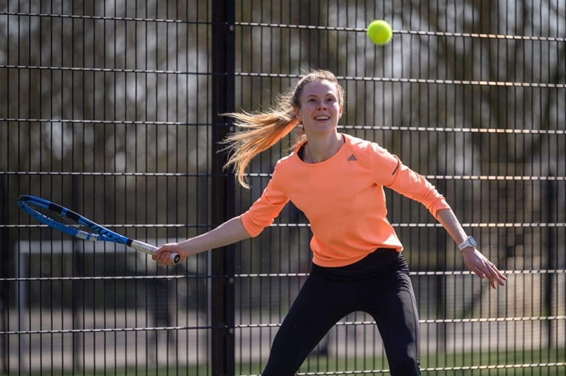 An amateur tennis player in action