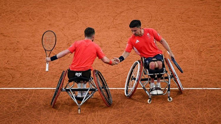 Alfie Hewett and Gordon Reid high five in the Paralympics semi-final