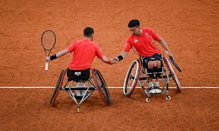 Alfie Hewett and Gordon Reid high five in the Paralympics semi-final