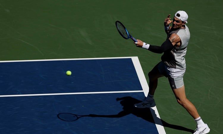 Jack Draper hitting a forehand on court at the US Open