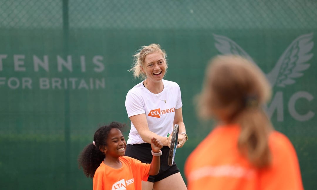 Alicia Barnett laughs while playing at an LTA SERVES event