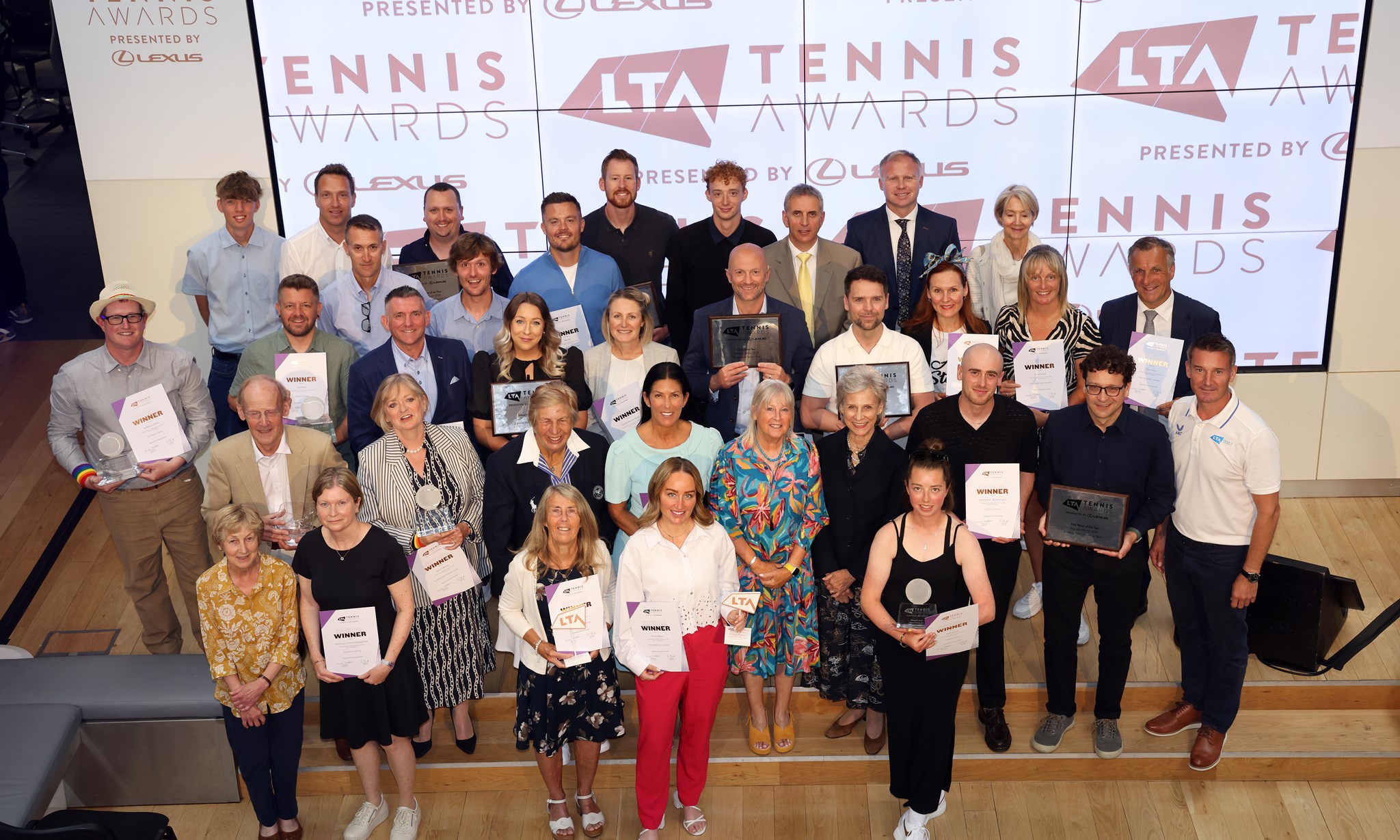 The award winners from the 2024 LTA Awards showing off their certificates