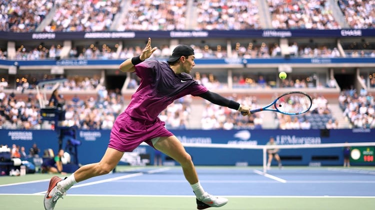 Jack Draper stretches for a backhand on Arthur Ashe at the US Open