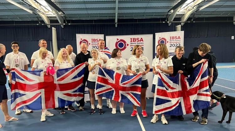 The GB visually impaired tennis team photographed together holding the Union Jack at the IBSA World Games 2023 in Birmingham, England.