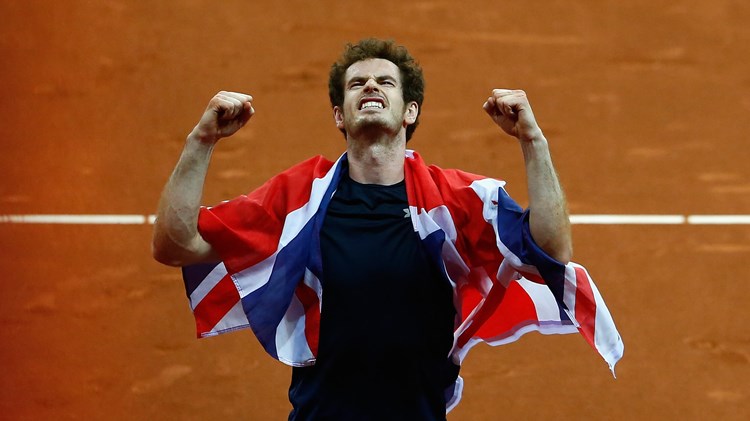 Andy Murray of Great Britain celebrates draped in Union Jack flag