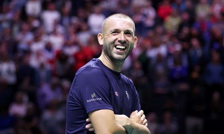 Dan Evans smiling after beating Alex De Minaur at the Davis Cup Finals