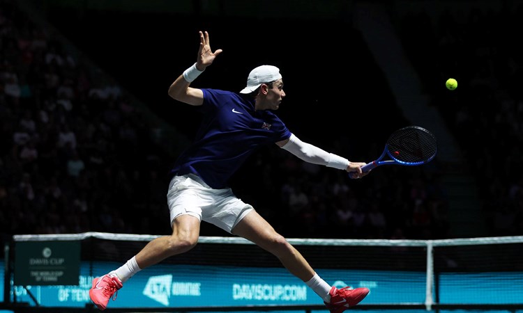 Jack Draper stretches for a backhand against Felix Auger-Aliassime at the Davis Cup