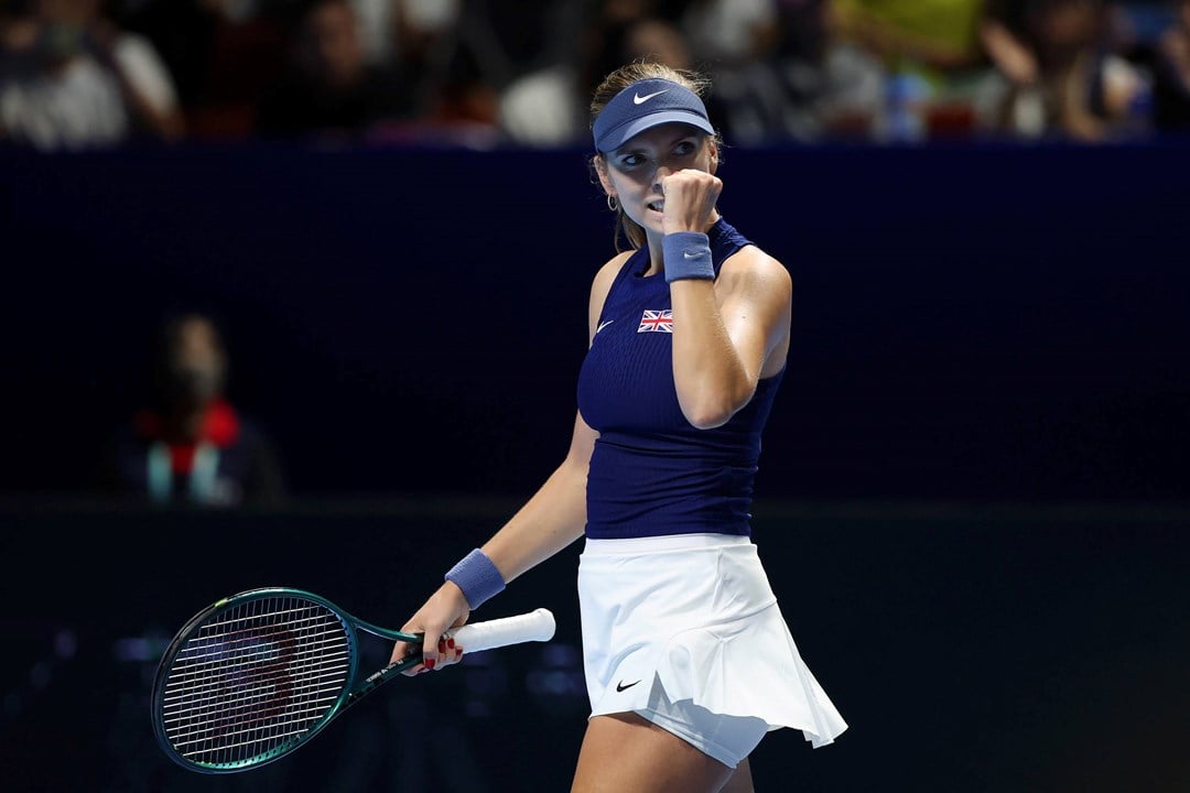 British tennis player Katie Boulter clenching her fist on court after winning a point during Great Britain's Billie Jean King Cup tie against Japan