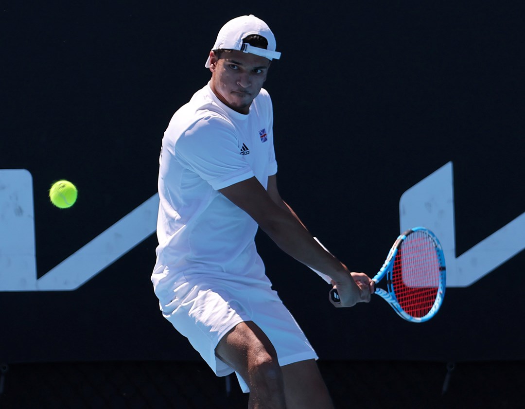 Esah Hayat preparing to hit a backhand on court