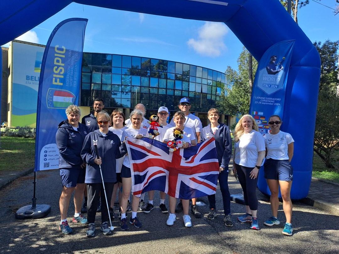 Great Britain's visually impaired tennis team pictured with the Union Jack during the 2024 IBTA Blind World Tennis Championships Lignano Sabbiadoro, Italy