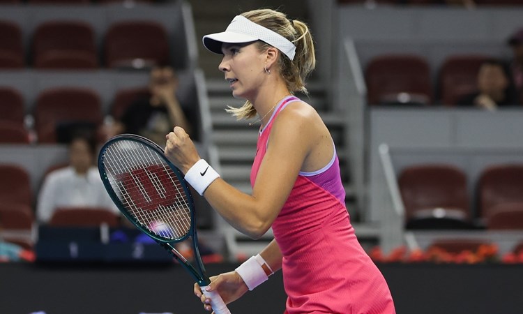 Katie Boulter competing at the WTA 1000 China Open while clenching her fist