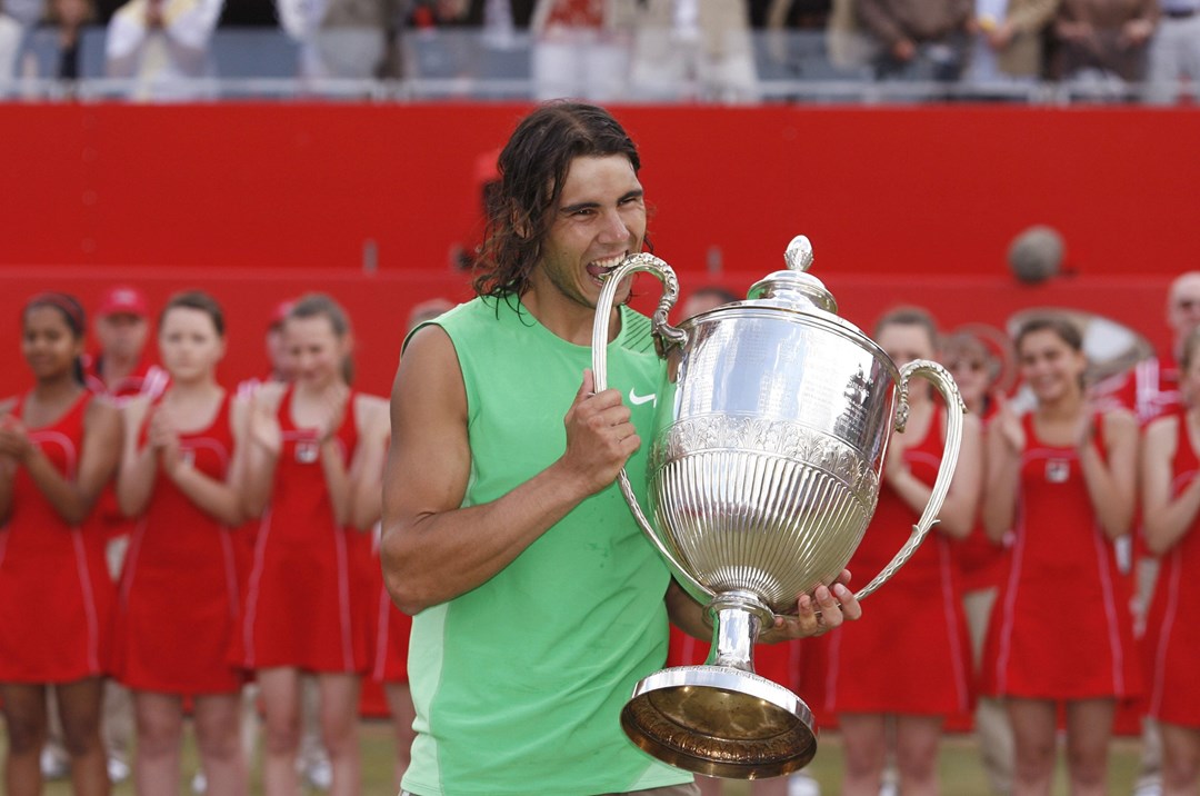 Rafael Nadal bites the Queen's Club trophy after beating Novak Djokovic in the 2008 final