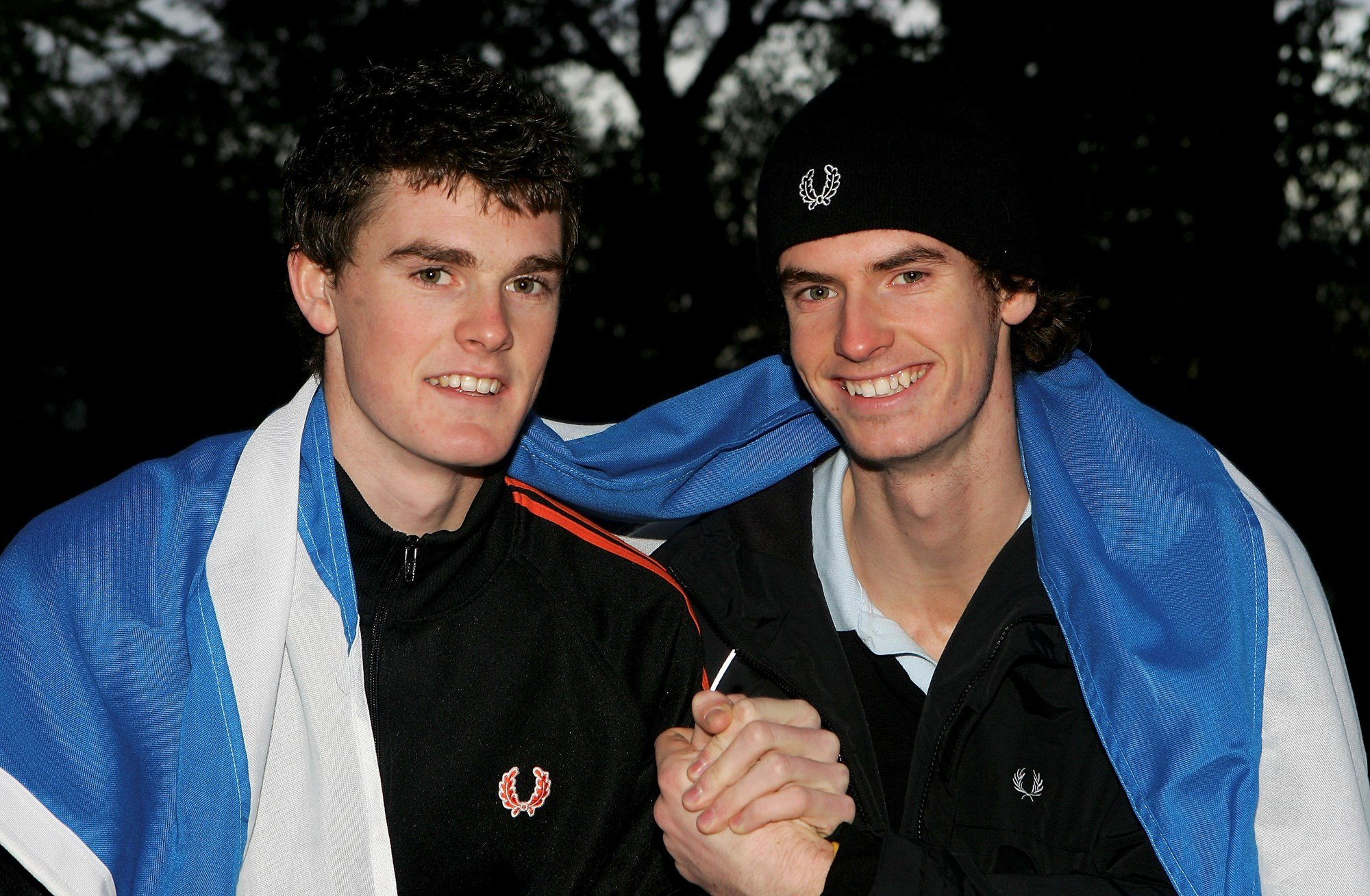 Jamie Murray and Andy Murray pose for a photo previewing the Aberdeen Tennis Cup in 2005