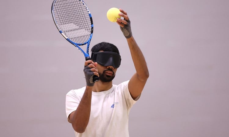 aqi Rizi plays against Roy Turnham during Visually Impaired Tennis National Finals 2022 match at Wrexham Tennis Centre on November 20, 2022 in Wrexham, Wales.