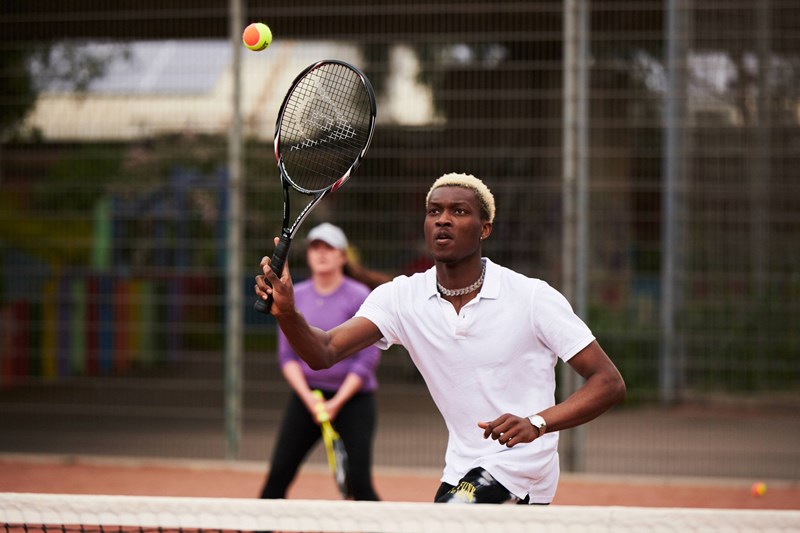 Tennis player on court ready for a volley