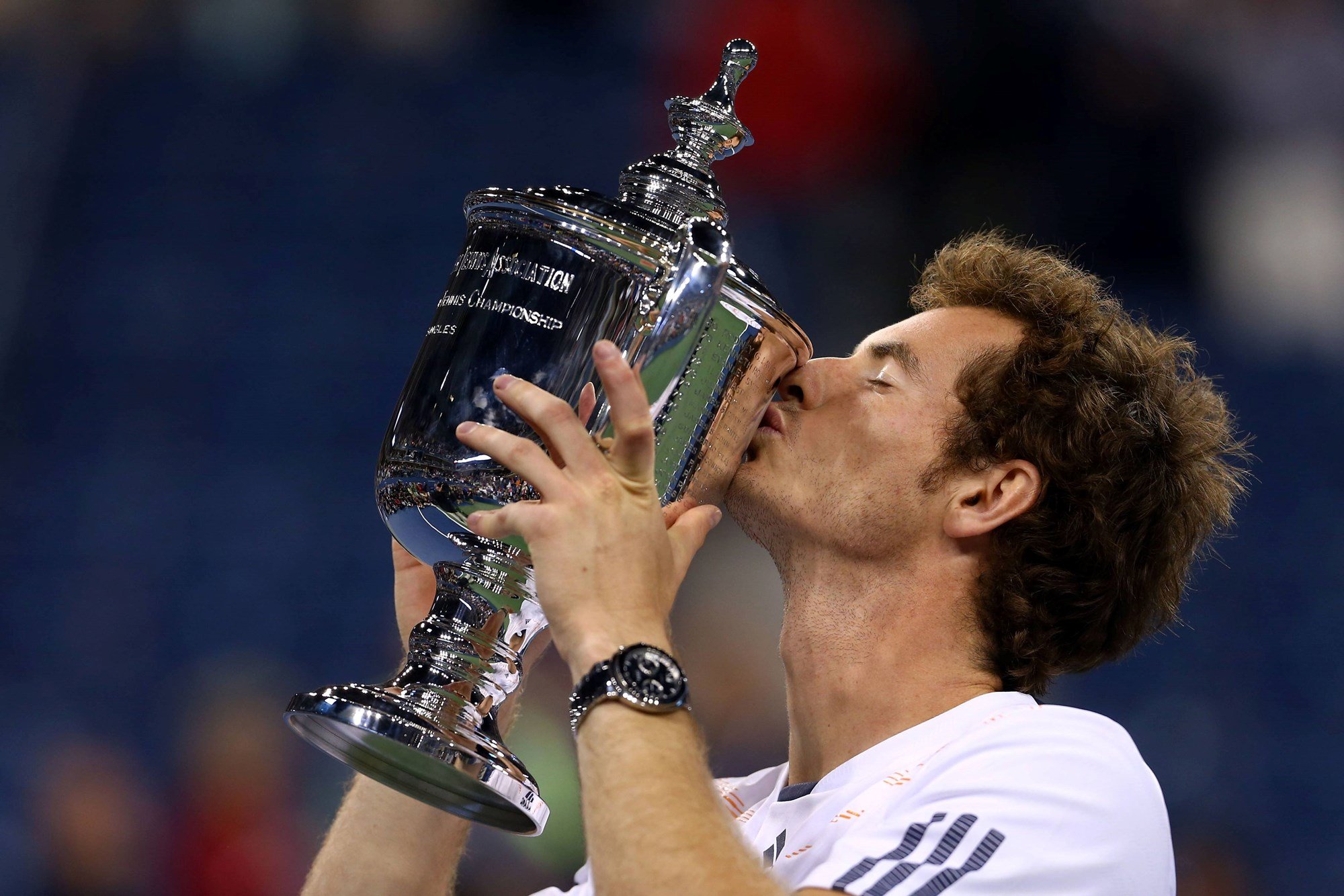 Andy Murray kisses the 2012 US Open trophy - his first of three Grand Slam titles and the first British man to win a major in 76 years