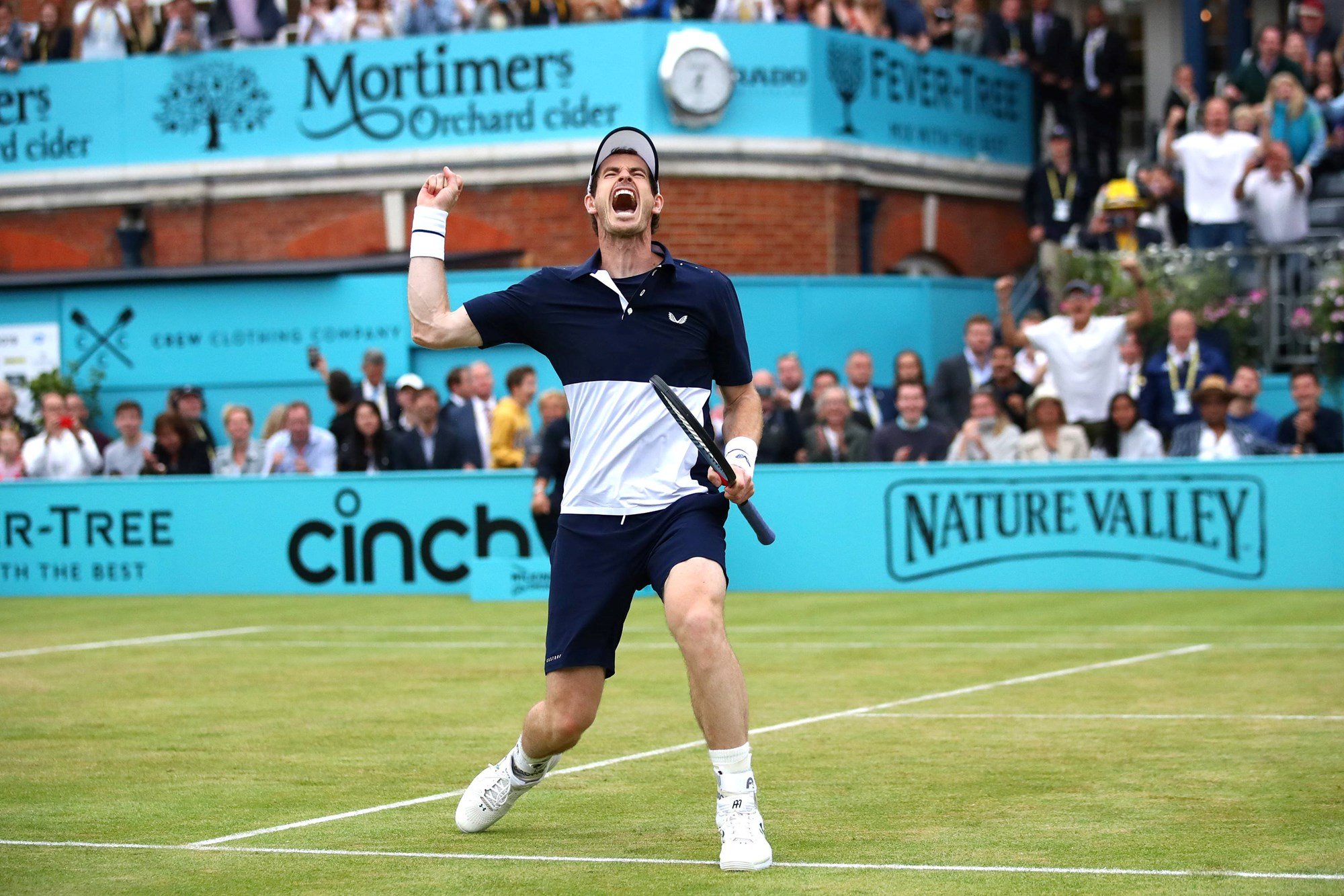 Andy Murray celebrates winning the 2019 Queen's Club Championships doubles title with Feliciano Lopez after coming back from injury in 2019