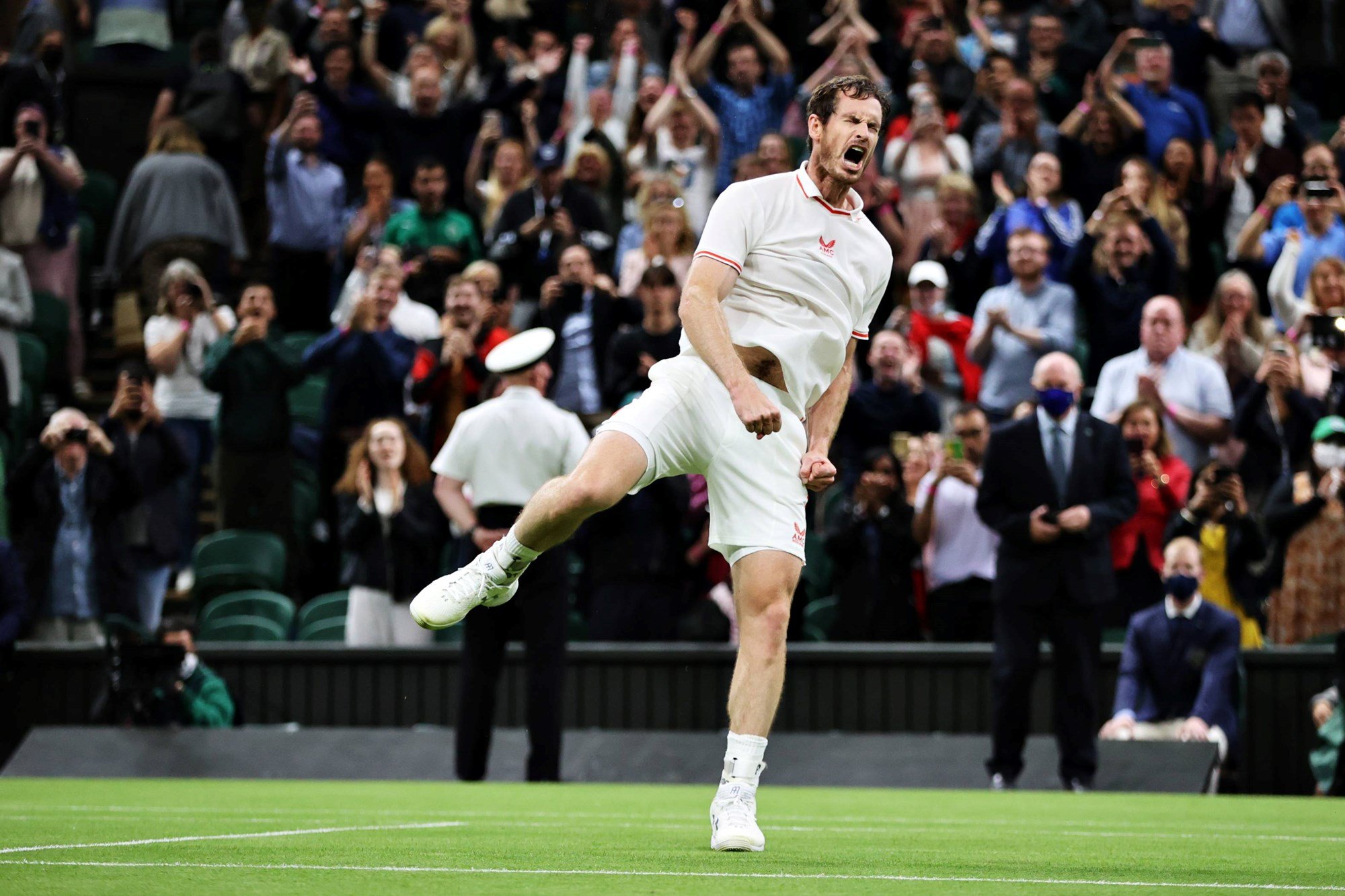 Andy Murray celebrates victory after winning his Wimbledon men's singles first round match against Nikoloz Basilashvili in 2021