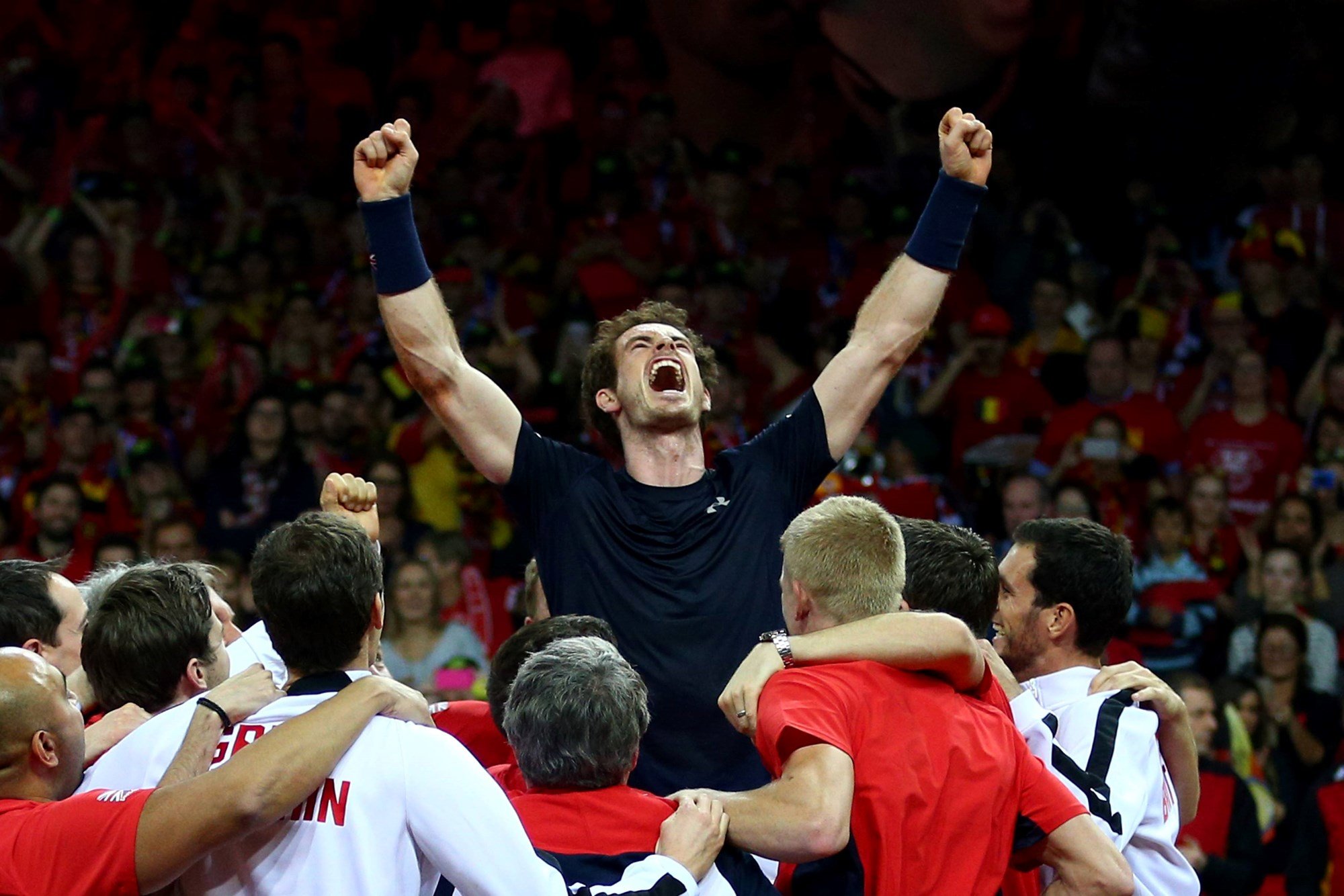 Andy Murray of Great Britain celebrates with his team after winning his singles match against David Goffin of Belgium and clinching the Davis Cup