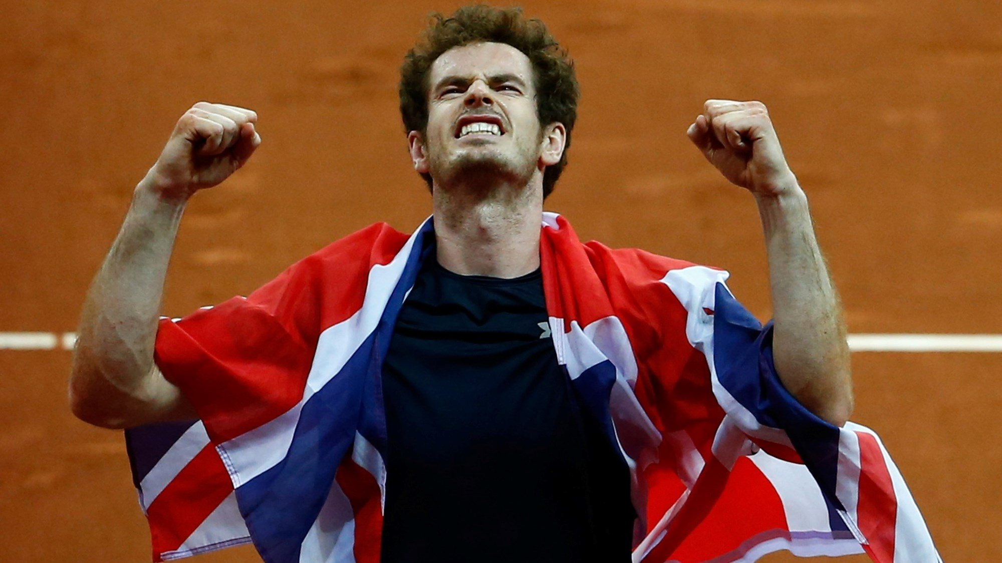 Andy Murray of Great Britain celebrates winning his singles match against David Goffin of Belgium and clinching the Davis Cup