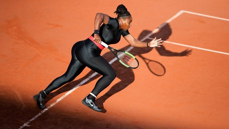 Serena Williams of the United States in action against Julia Goerges of Germany in the evening light on Court Suzanne Lenglen at the 2018 French Open