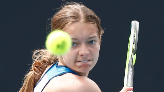 Matilda Mutavdzic with her eyes on the ball before hitting a forehand