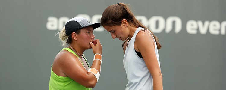 Tara Moore and Emina Bektas meet during their doubles match in Lexington