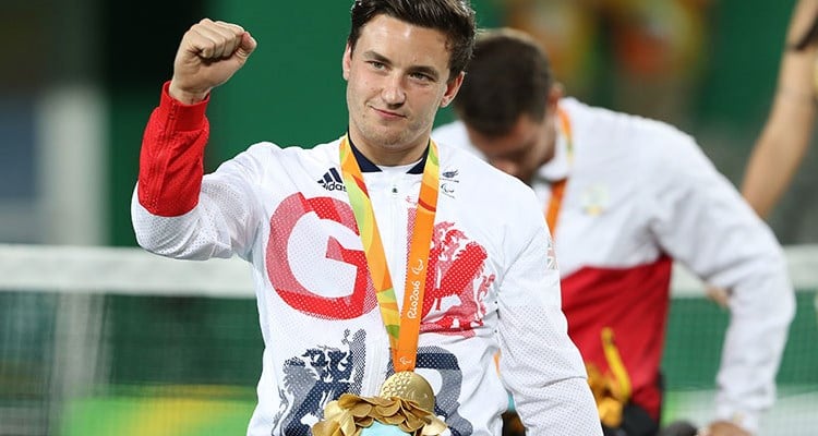 Gordon Reid celebrating with a medal on