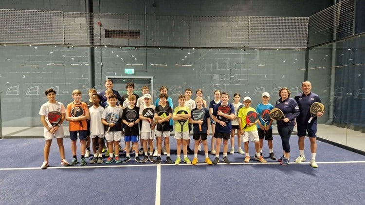 Libby Fletcher and Steve Yeardley stood on court with their junior padel players at the National Performance Junior Camps