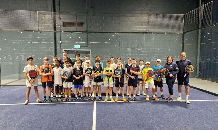 Libby Fletcher and Steve Yeardley stood on court with their junior padel players at the National Performance Junior Camps