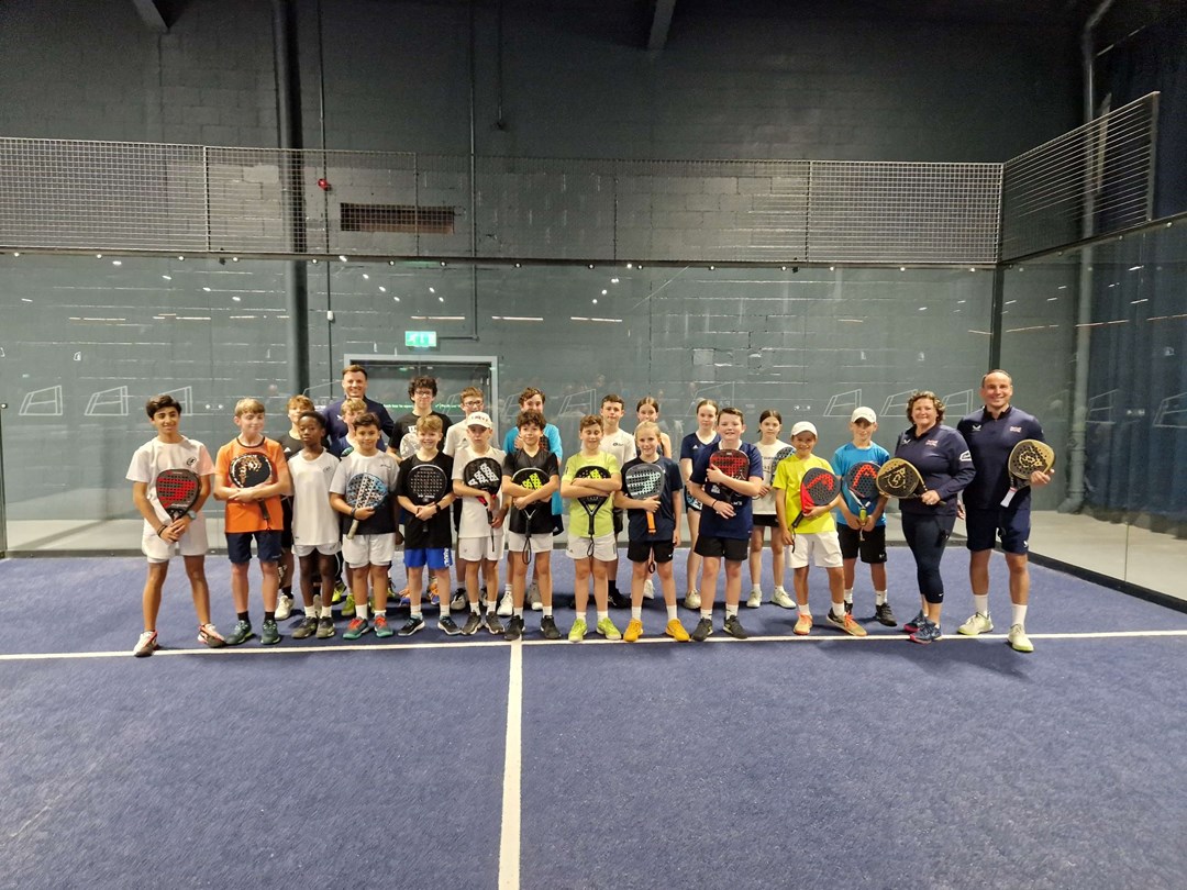 Libby Fletcher and Steve Yeardley stood on court with their junior padel players at the National Performance Junior Camps