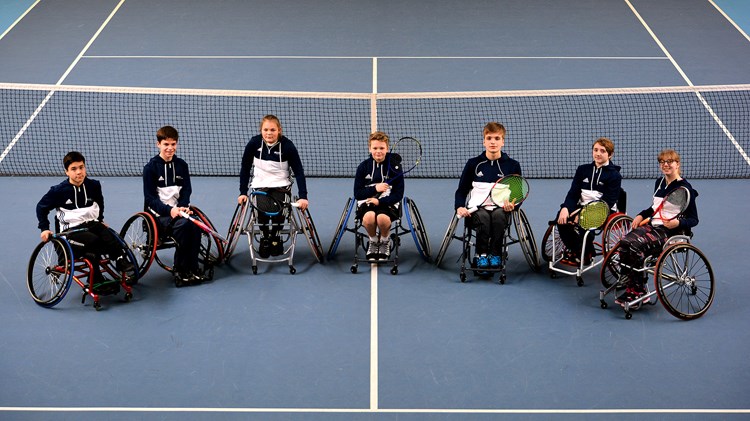 Group of junior wheelchair tennis players