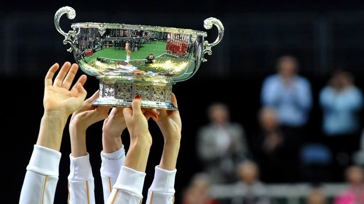 Members of the Czech Fed Cup Tennis team hold the trophy of the International Tennis Federation Fed Cup on November 4, 2012, in Prague.