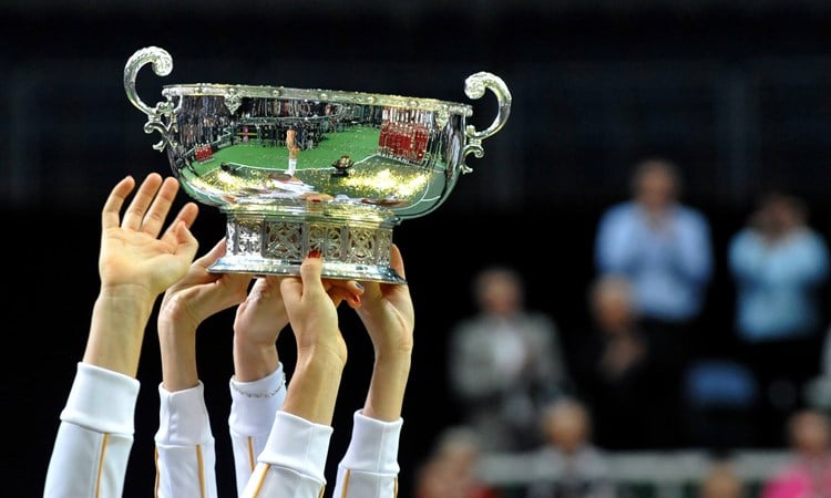 Members of the Czech Fed Cup Tennis team hold the trophy of the International Tennis Federation Fed Cup on November 4, 2012, in Prague.