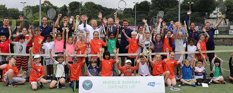 Adults and children celebrating the first ‘Middle Sunday Opened Up’ free tennis festival