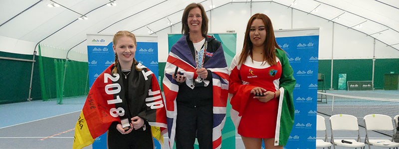 Tennis players on the podium at the International Blind Tennis tournament in 2019