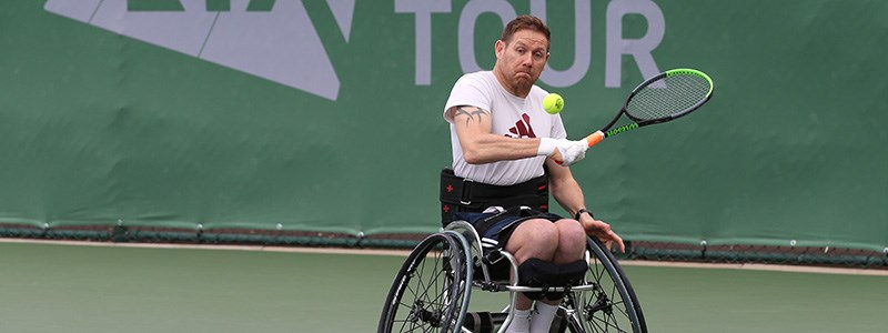 antony cotterill about to hit a ball coming towards him at lta torunamet