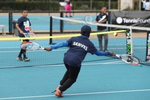 Tennis serves friendly junior match