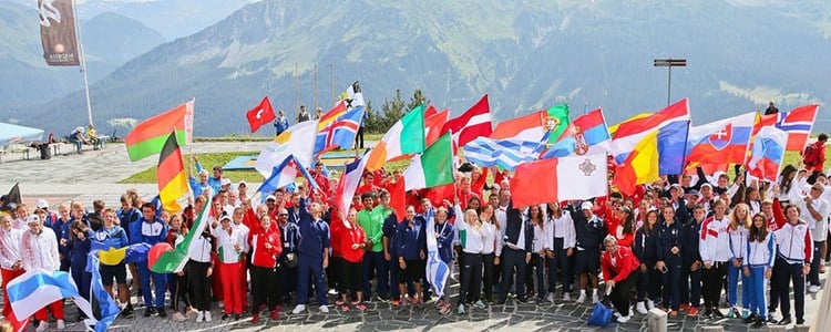 Large group of people waving different national flags